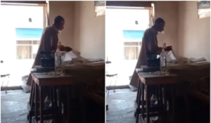 Elderly man spits water on clothes while ironing them.