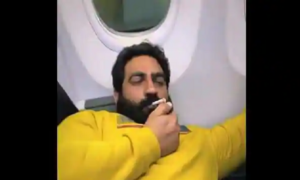 Video screenshot of social media influencer from Haryana – Bobby Kataria – smoking inside of a flight.